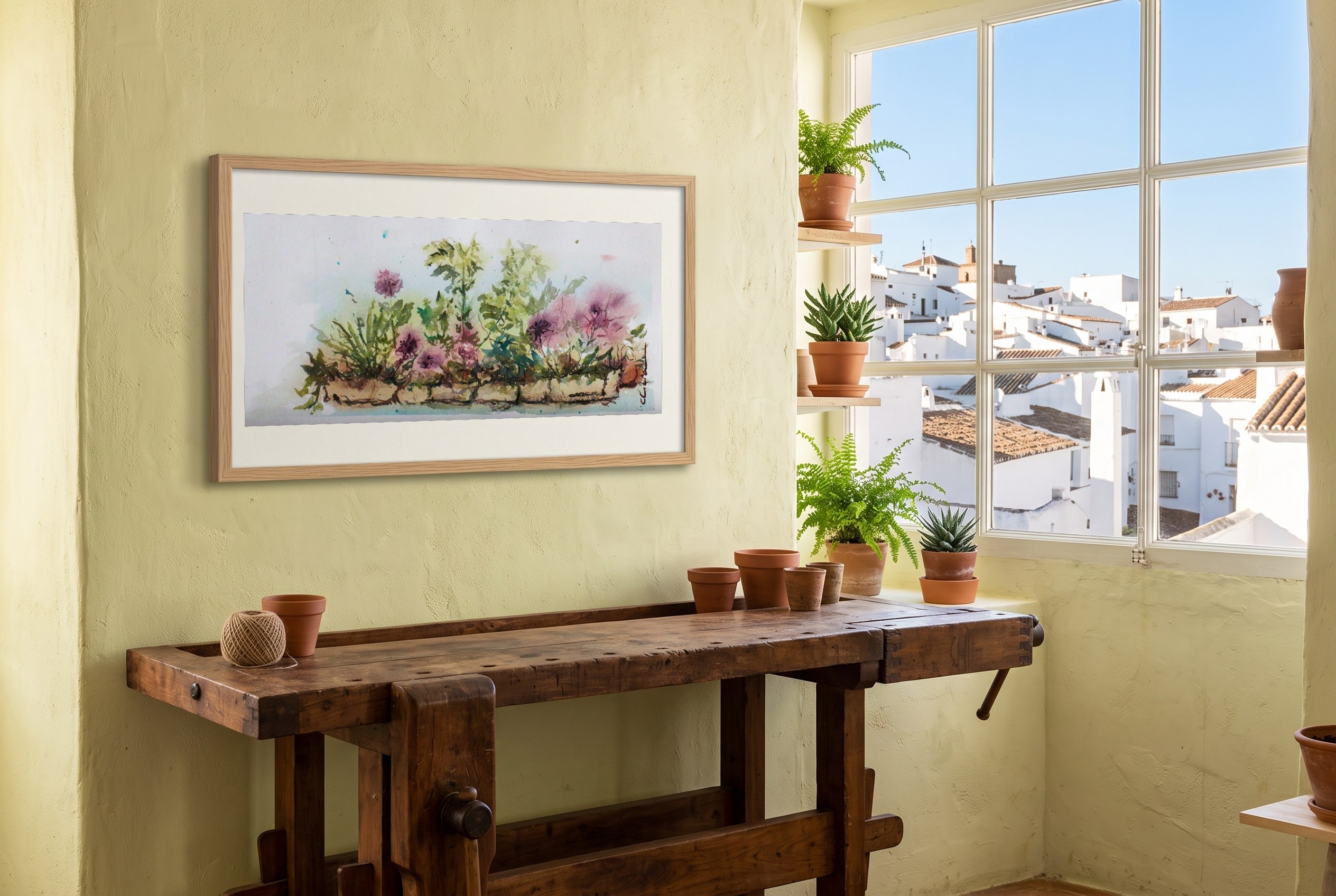 «Jardinera en flor», cuadro original de Alicia Prado, colgado en estudio de cerámica en un pueblo blanco